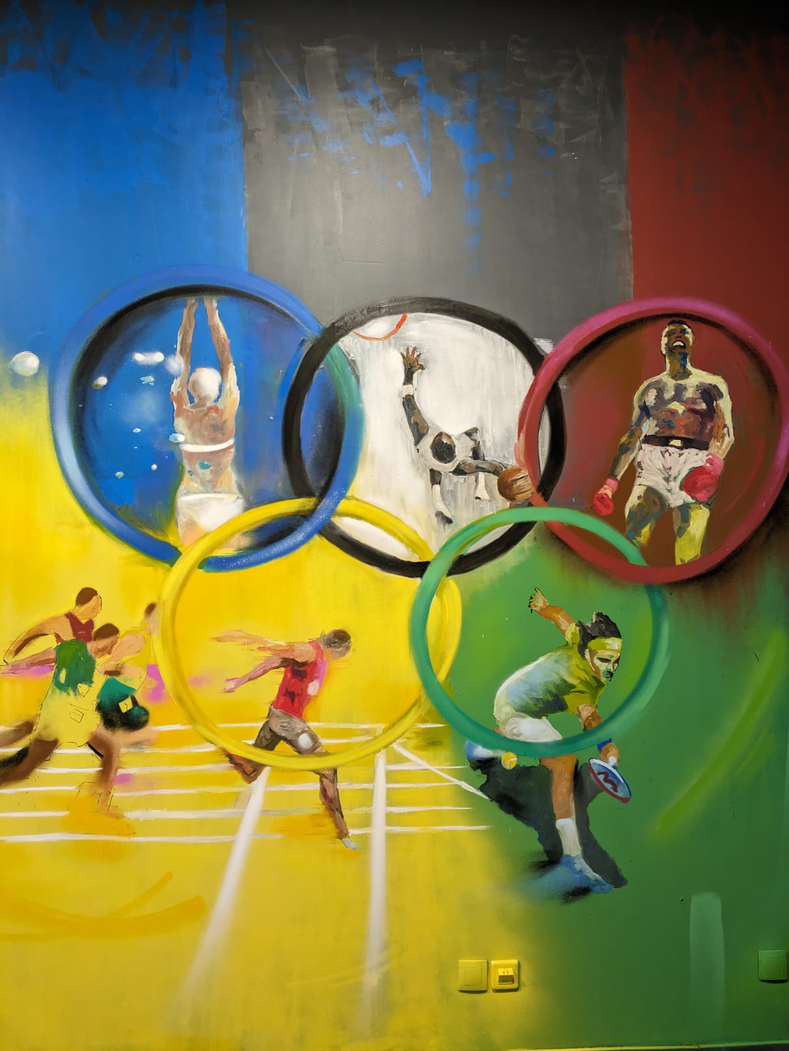 Une peinture représentant les anneaux olympiques
