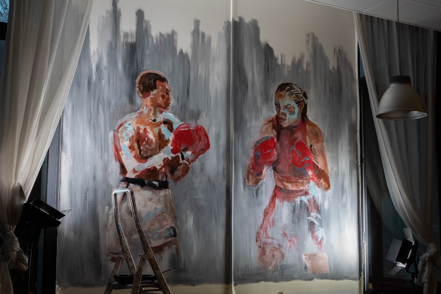 Deux boxeurs, un homme et une femme, face à face