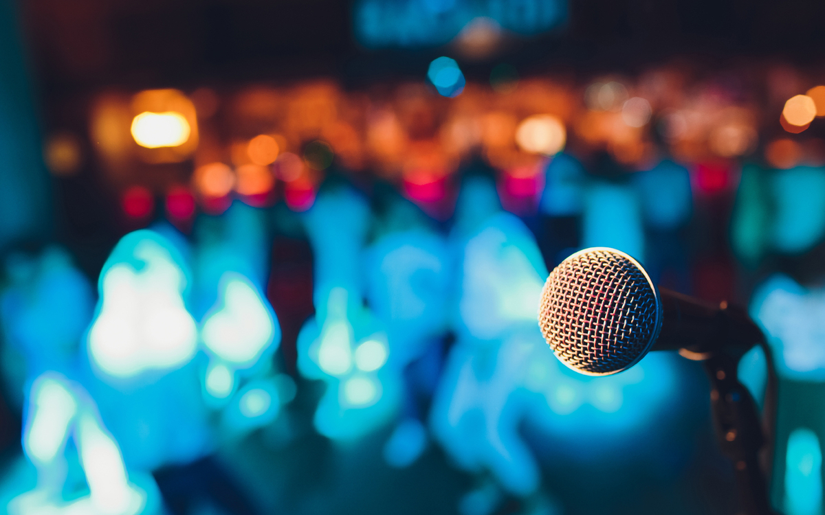 A microphone in front of a crowd
