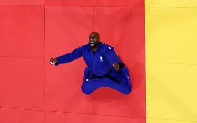 Teddy Riner celebrates his Olympic victory