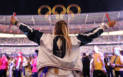 An athlete from Team France at the Olympic closing ceremony