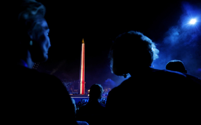 General view inside the venue as the Luxor Obelisk is illuminated in the colors of the French national flag during the opening ceremony of the Olympic Games.