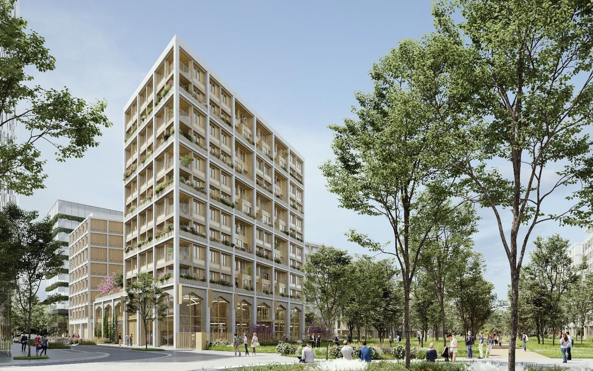 Un immeuble blanc entouré d'arbres