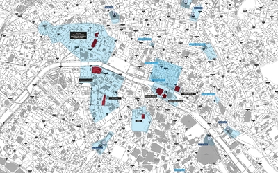Photographie d'un plan de la ville de Paris avec les différentes zones concernées par les couvre-feux. 