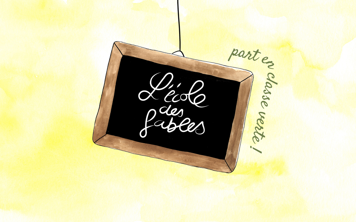 Une ardoise avec le titre du spectacle écrit à la craie