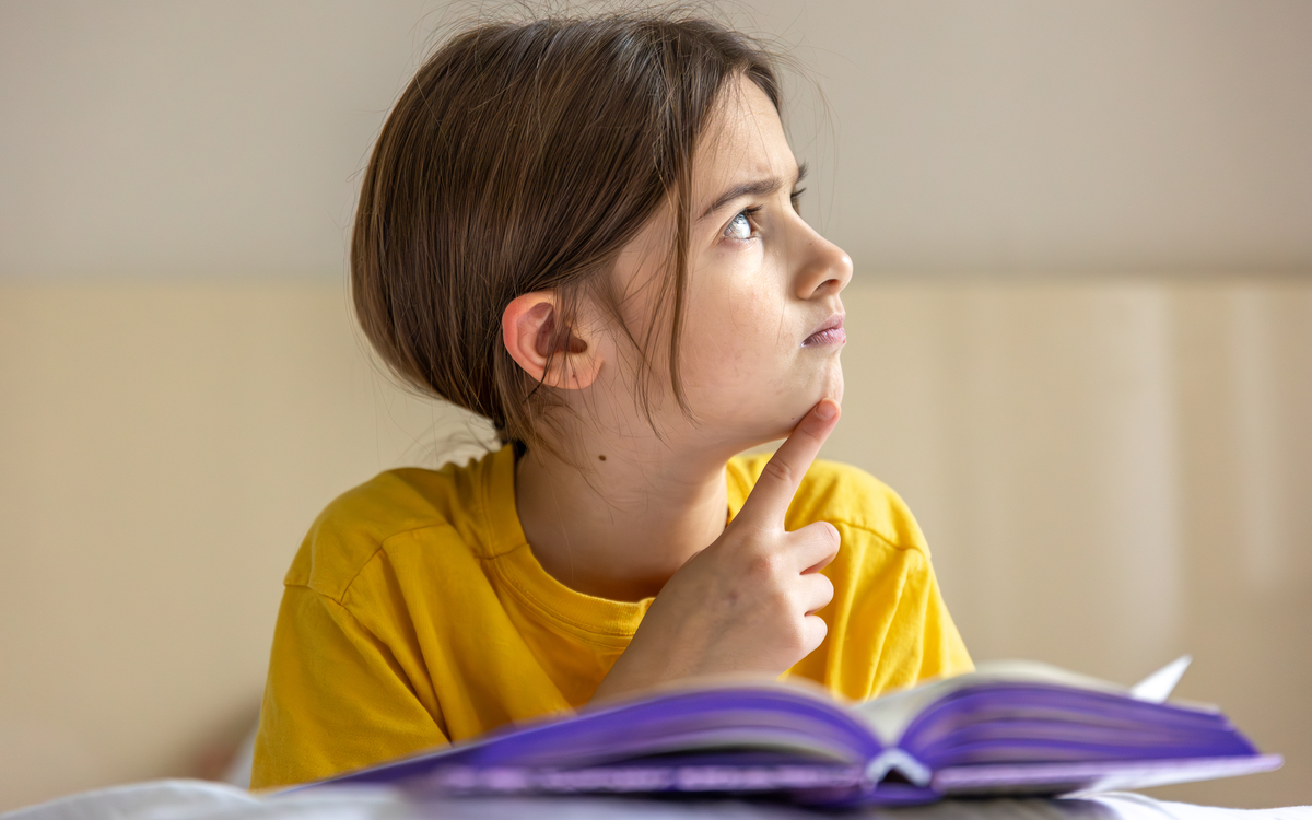 interested-focused-girl-is-reading-book-emotion-concept
