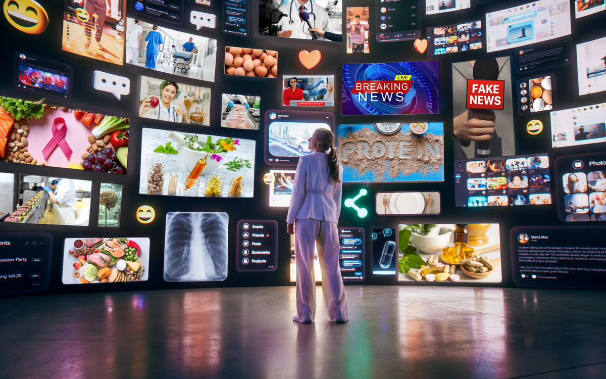 Une femme devant une multitude d'écran proposant des informations en santé